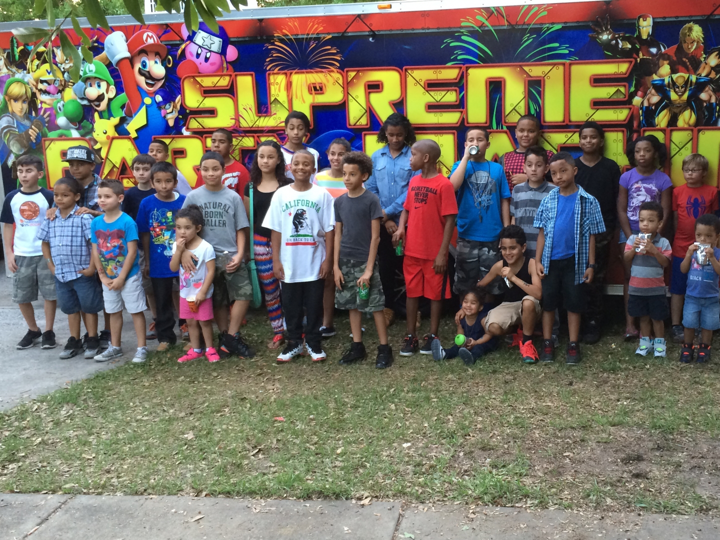 Group shot in front of the Supreme Party Machine